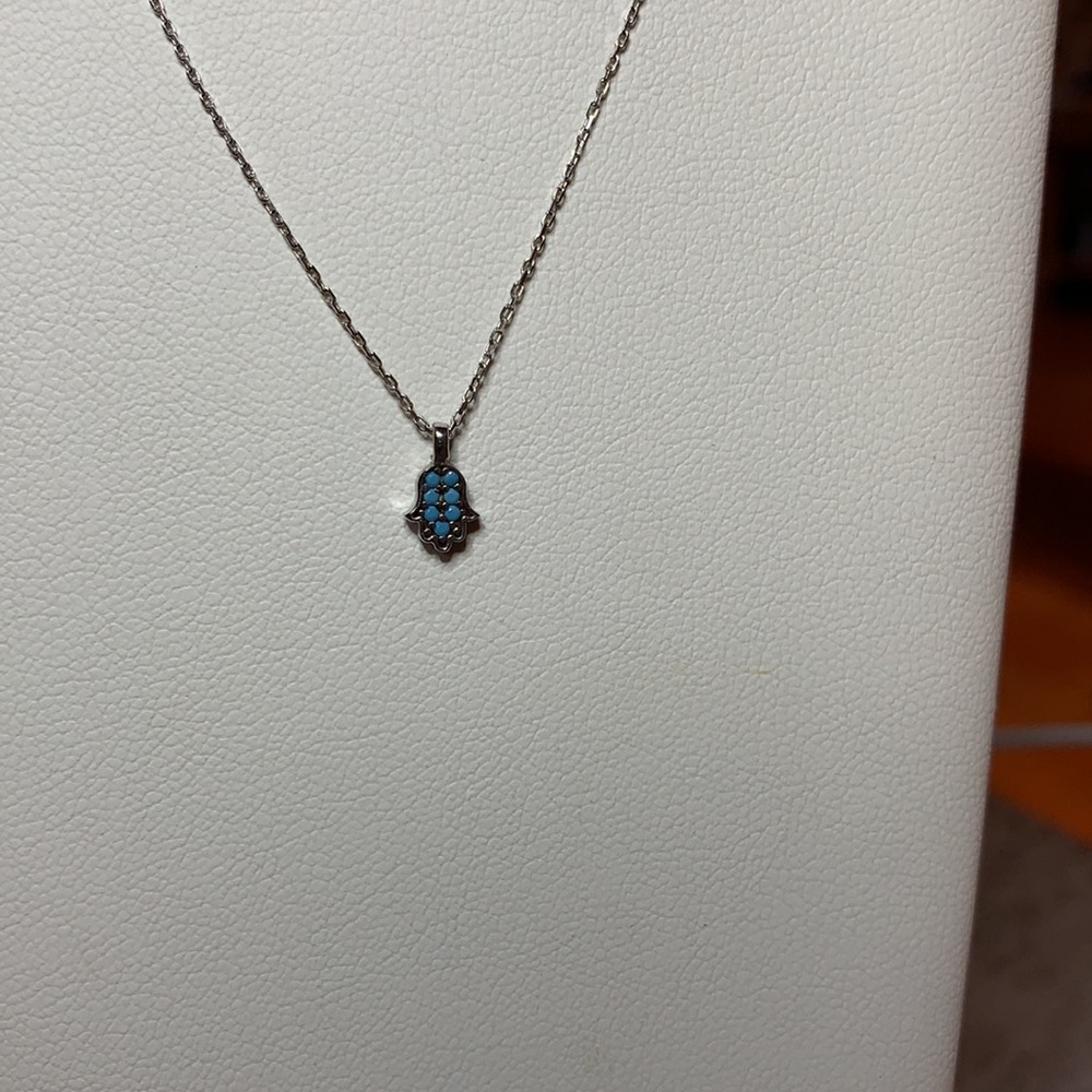 Mini hamsa with light blue stone